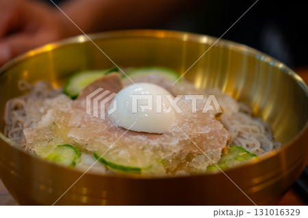 Refreshing Korean Cold Noodles Naengmyeon with Beef Cucumber and Boiled Egg Refreshing Korean Cold Noodles Naengmyeon with Beef Cucumber and Boiled Egg 131016329