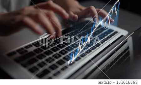 Hands Typing on Laptop Keyboard with Data Visualization of Financial Growth Trends and Progress Displayed on Screen Reflecting Success in Business Analysis Copula 131016365
