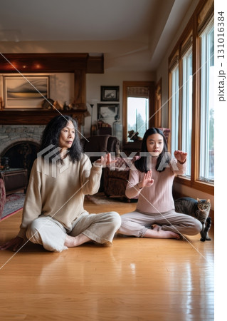 Engaging in a Heartfelt Mother and Daughter Mindfulness Practice Together at Home 131016384