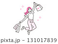 人物 買い物袋を持ってジャンプをする若い女性 131017839