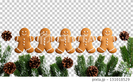 Decorated Christmas gingerbread cookies and pine cones on wooden table isolated on white background 131018529