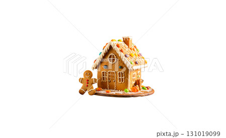 A sweet gingerbread house decorated with icing sugar and colorful candies stands alone on a white background. A sweet gingerbread house decorated with icing sugar and colorful candies stands alone on a white background. 131019099