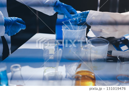 Researchers working in the clinical laboratory Researchers working in the clinical laboratory 131019476