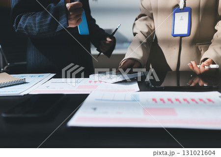 Close up high angle Asian businesswoman working with her coworker in meeting room 131021604