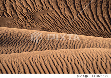 Intricate and beautiful patterns of windsculpted sand dunes in nature 131023379