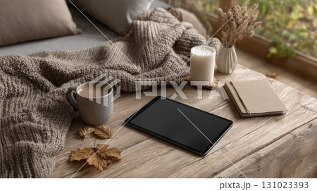 Digital tablet on autumn wooden table 131023393