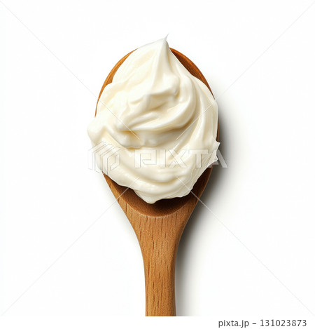 Top view of Fresh mayonnaise yogurt or sour cream caramel on wooden spoon isolated on white background 131023873