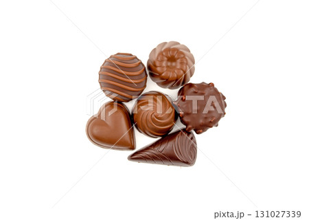 A close up of a chocolate dessert with a heart shaped piece 131027339