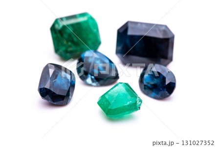 A collection of gemstones, including a green and blue one 131027352