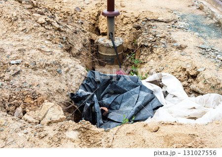 Construction Pit Featuring Newly Installed Urban Streetlight Pole, Highlighting Modern Urban Infrastructure Development and Safety Enhancements Construction Pit Featuring Newly Installed Urban Streetlight Pole, Highlighting Modern Urban Infrastructure Development and Safety Enhancements 131027556