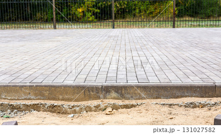 Spacious Park Square Paved with Construction Stones: A Beautifully Designed Outdoor Area for Leisure and Community Activities in Urban Environment 131027582