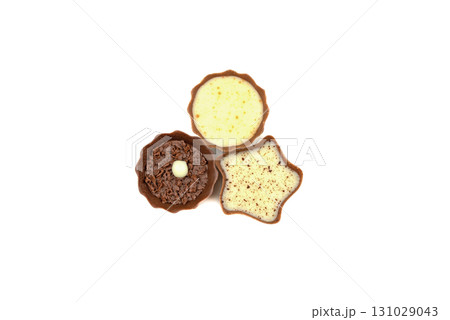 Three different shaped chocolate treats are displayed on a white background Three different shaped chocolate treats are displayed on a white background 131029043