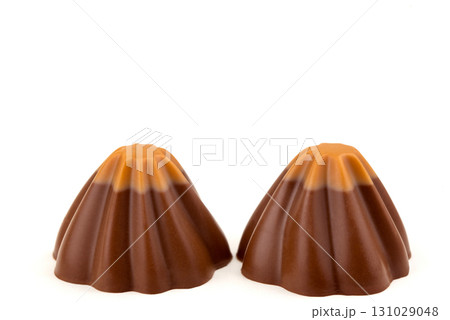 Two chocolate covered pastries with a brown and tan swirl Two chocolate covered pastries with a brown and tan swirl 131029048