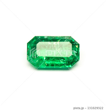 A green gemstone is sitting on a white background 131029322