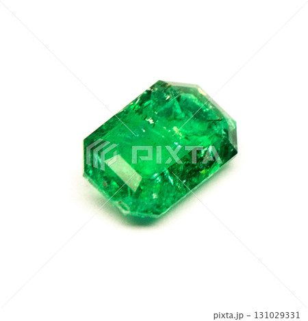 A green gemstone is sitting on a white background 131029331