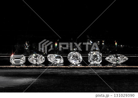 A row of diamonds are displayed on a table A row of diamonds are displayed on a table 131029390