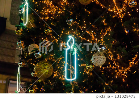 Detail of decorated christmas tree with xmas lights Detail of decorated christmas tree with xmas lights 131029475