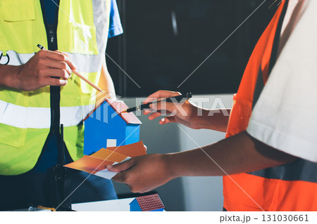 Closeup of team of industrial engineers meeting analyze machinery blueprints consult project on table in manufacturing factory. Working in manufacturing plant or production plant. 131030661