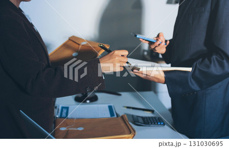 Lawyer explained to the client about the law that must be brought against the court case. Lawyer explained to the client about the law that must be brought against the court case. 131030695