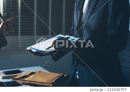 Lawyer explained to the client about the law that must be brought against the court case. Lawyer explained to the client about the law that must be brought against the court case. 131030707