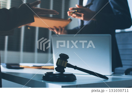 Lawyer explained to the client about the law that must be brought against the court case. Lawyer explained to the client about the law that must be brought against the court case. 131030711