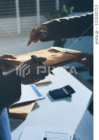 Lawyer explained to the client about the law that must be brought against the court case. Lawyer explained to the client about the law that must be brought against the court case. 131030713