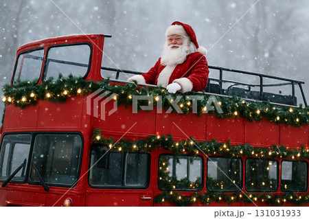 Santa claus riding a festive double-decker bus decorated with garland and lights in snowy winter wonderland. concept of christmas celebration, holiday spirit, festive transport. 131031933