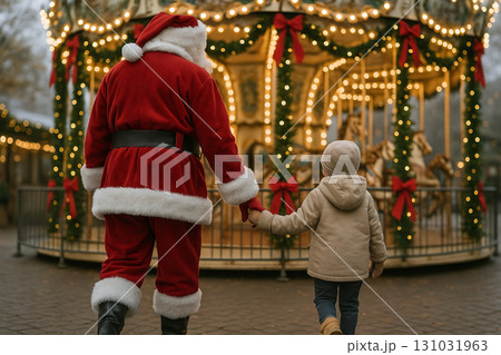 Santa walking with child towards carousel decorated with festive christmas lights during holiday season. concept of festive celebration, christmas magic, family bonding Santa walking with child towards carousel decorated with festive christmas lights during holiday season. concept of festive celebration, christmas magic, family bonding 131031963