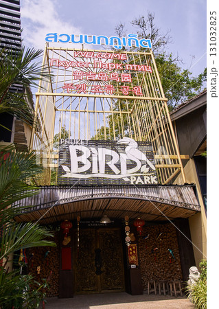 Entrance of phuket bird park with multilingual signage and tropical 131032825