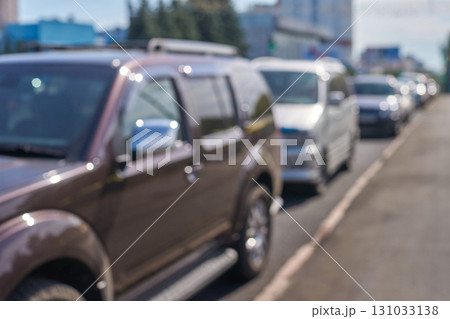 Blurred traffic jam of various cars on city street during busy daytime Blurred traffic jam of various cars on city street during busy daytime 131033138