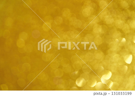Golden bokeh background with abstract light circles in warm yellow tones Golden bokeh background with abstract light circles in warm yellow tones 131033199