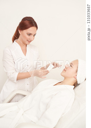 Female caucasian aesthetician with young female client in spa for skincare Female caucasian aesthetician with young female client in spa for skincare 131033687