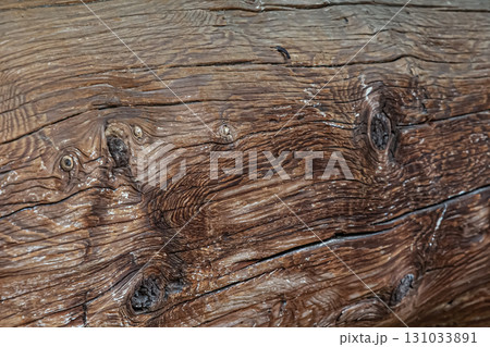 wooden background natural pine beam with cracks closeup wooden background natural pine beam with cracks closeup 131033891