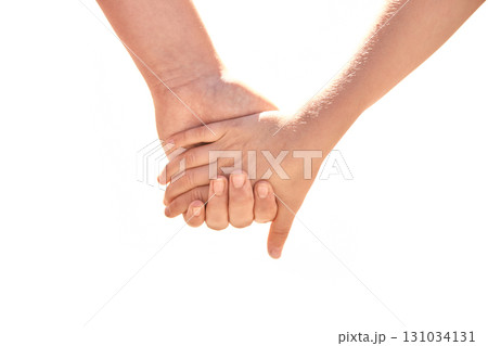 Closeup of two children holding hands signifying friendship and trust 131034131