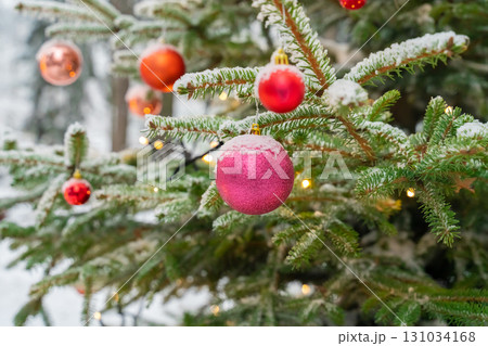 christmas set red balls decoration on christmas tree covered with snow 131034168