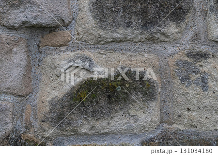 gray stone wall of the castle close-up, background of large cobblestones gray stone wall of the castle close-up, background of large cobblestones 131034180
