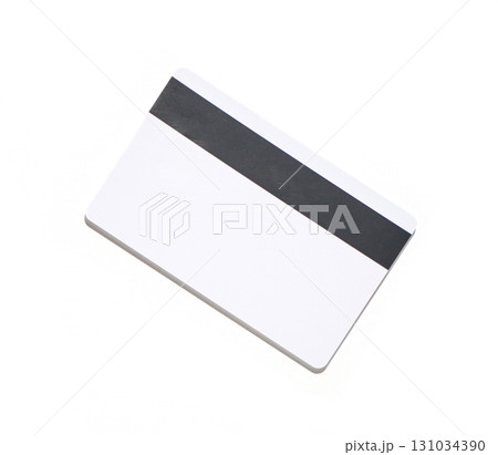 White plastic card with black magnetic stripe isolated on white background White plastic card with black magnetic stripe isolated on white background 131034390