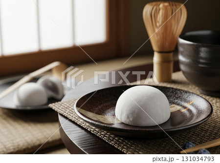 Traditional Japanese daifuku mochi served on a ceramic plate for a minimalist tea ceremony 131034793