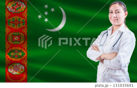 Female doctor on Turkmenistan flag. Doctor with crossed arms on Turkmenistan flag. Turkmenistan health and care concept 131035691