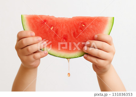 Child hands holding fresh watermelon slice with juice dripping isolated on white background. concept of summer refreshment, healthy snack, fruit enjoyment 131036353
