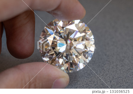 Diamond Holding on Jeweler Hand Diamond Holding on Jeweler Hand 131036525