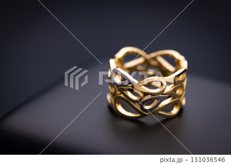 Gold Jewelry Ring on Black Box 131036546