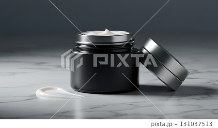 Luxurious black skincare cream jar with silver accents and smooth white texture swatch on marble Luxurious black skincare cream jar with silver accents and smooth white texture swatch on marble 131037513