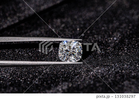 A diamond is on a black surface 131038297