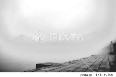 A solitary bridge emerges from the ethereal embrace of mist. 131039106