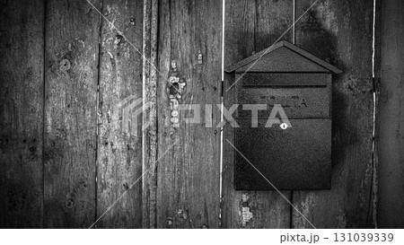 Rusty Mailbox on an Old Wooden Fence Vintage Rural Scene 131039339