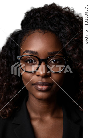 A Black woman with natural curls and large glasses, her focused expression surrounded by luminous patterns, symbolizing leadership, innovation 131039371