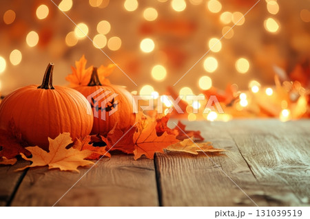 Festive pumpkins with autumn leaves and warm lights Festive pumpkins with autumn leaves and warm lights 131039519