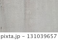 Textured grey concrete wall with weathered imperfections and subtle gradient background 131039657