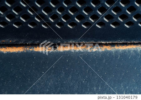 Rust and wear marks on metal surface in close-up view indoors Rust and wear marks on metal surface in close-up view indoors 131040179
